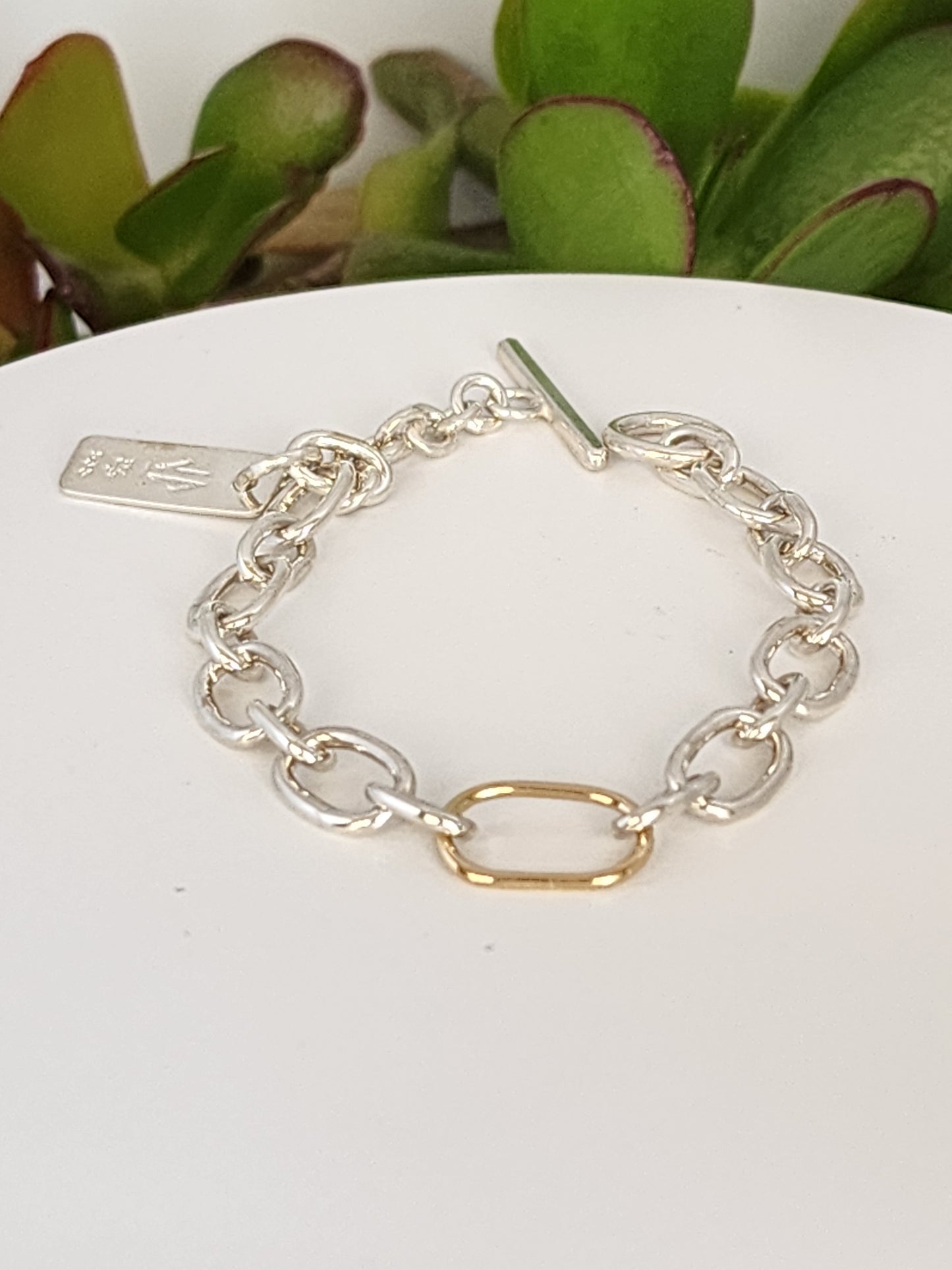 women's silver and gold bracelet